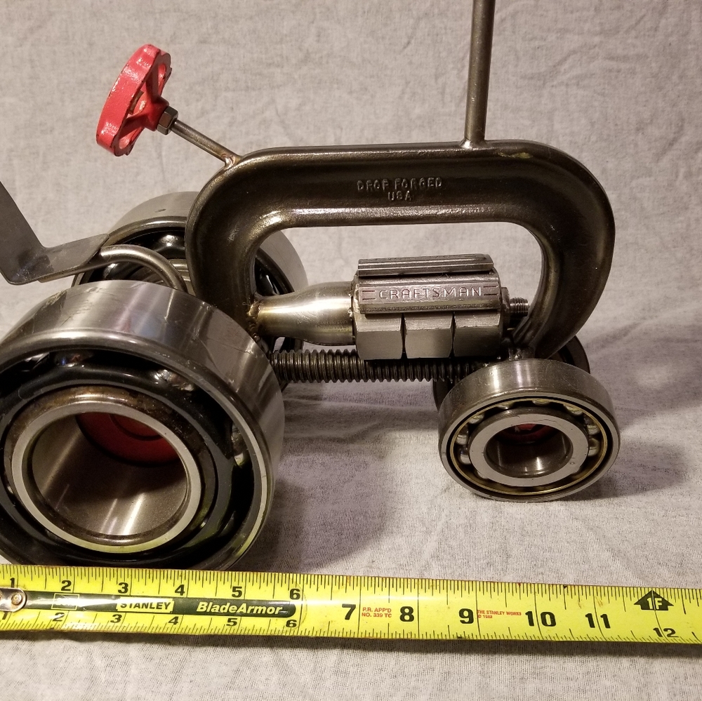 Tractor made out of c clamp and scrap metal